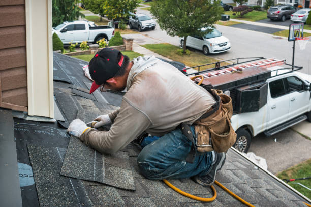 Professional Storm Damage Roof Repair technician working in Moorefield, KY